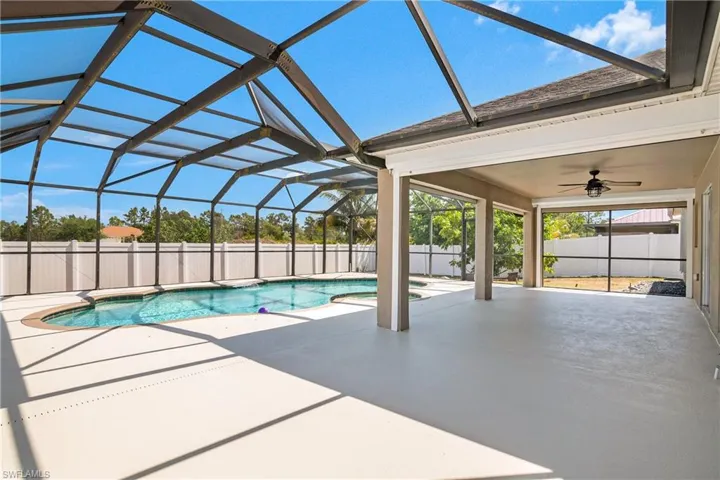 View of swimming pool with a fenced in pool, a ceiling fan, a fenced backyard, and a patio area