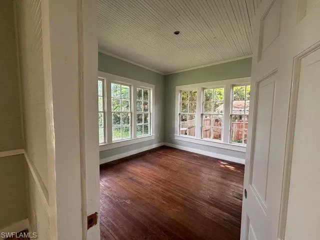 Unfurnished sunroom with plenty of natural light