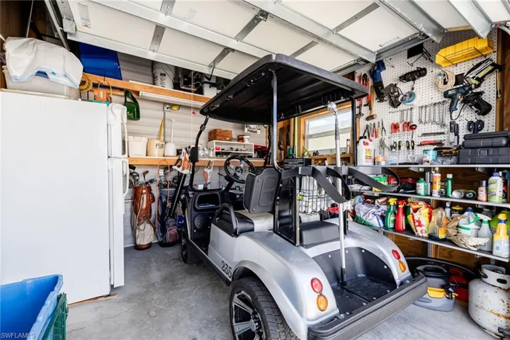 Garage with freestanding refrigerator