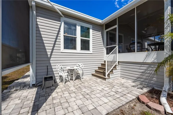 View of patio / terrace featuring a sunroom
