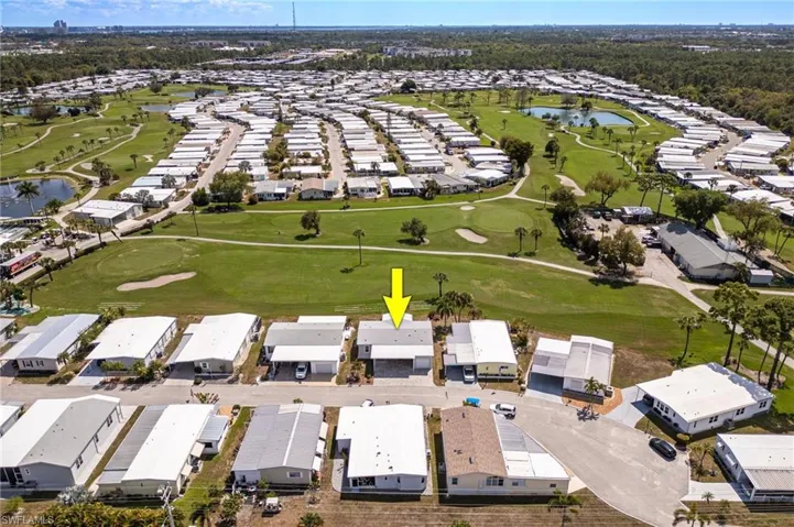 View of property location with a nearby body of water and nearby suburban area