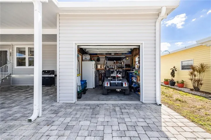 Garage with freestanding refrigerator