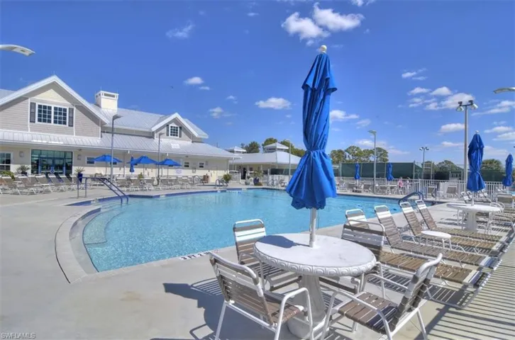 Community pool with a patio