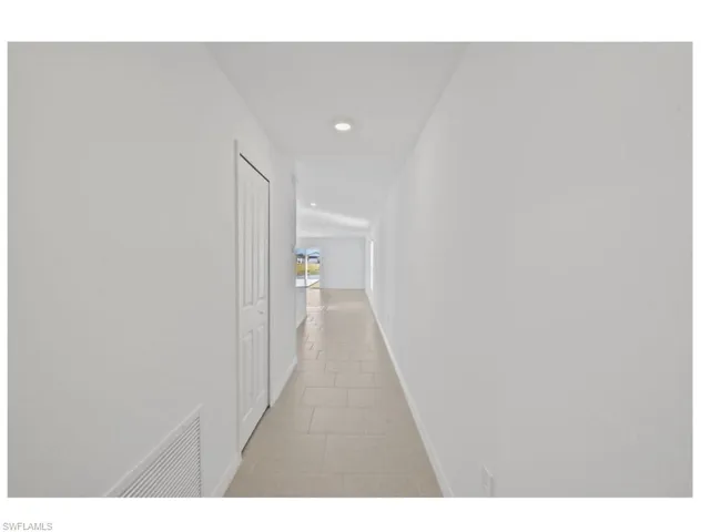 Welcoming entry with bright, open hallway.