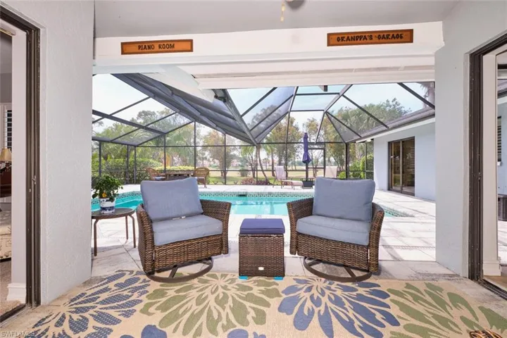 View of patio featuring an outdoor pool and screen enclosure