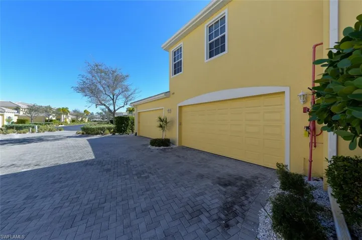 Side entry Full 2 car garage. Features 2 guest parking spaces next to the garage.