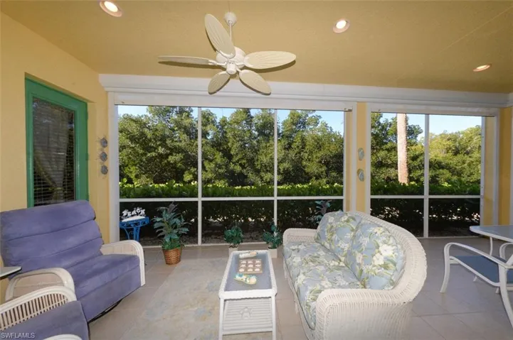 Large Lanai with tranquil natural Creek and Preserve views. Features electric roll down mesh style Hurricane shutters.