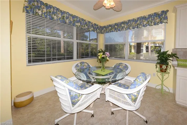 Open Breakfast nook with large windows overlooking the Tranquil Creek and Preserve