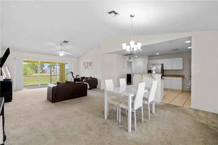 Empty room with carpet floors and ceiling fan