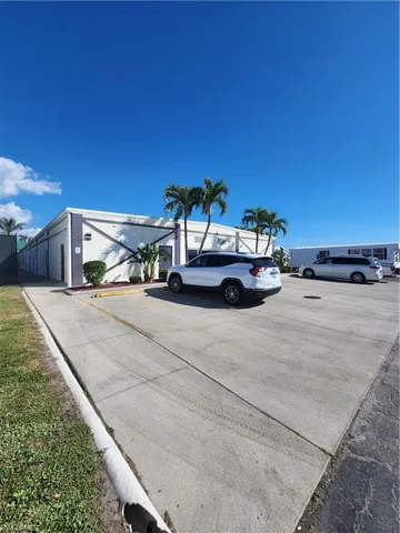 View of the indoor pool building and parking lot