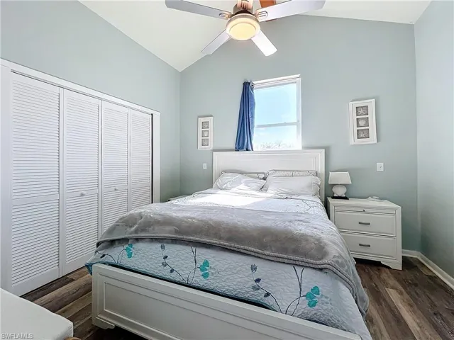 Main Bedroom with lofted ceiling, a closet, and a ceiling fan