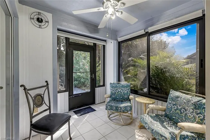 Sunroom featuring ceiling fan