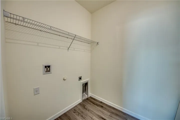 Inside laundry room with washer & dryer hookup.