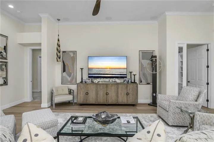 Great room entertainment center, master bedroom door to left, bedroom/den door to right