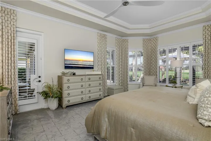 Bright during day, plantation shutters close for night, door opens to lanai, extensive crown molding