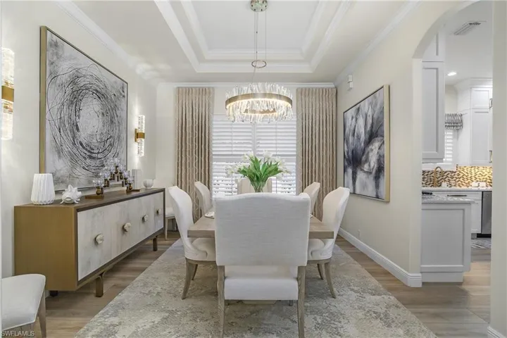 Magnificently appointed dining room, tray ceiling and new chandelier. Plantation shutters throughout the house.