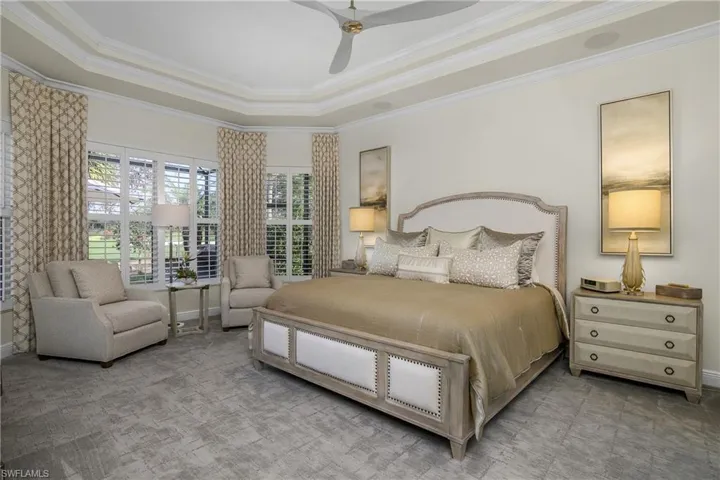 Master bedroom...enlarged with sitting area, tray ceiling, new fan, carpeted, new window coverings