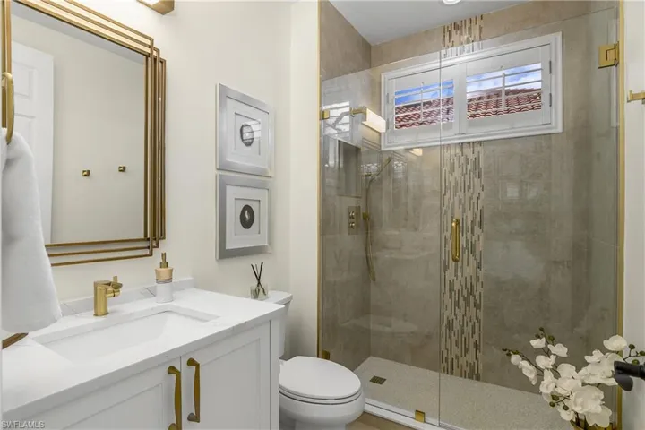 Newly remodeled guest bath...quartz counter, new sink and fixtures, new cabinetry, tub out...shower in.