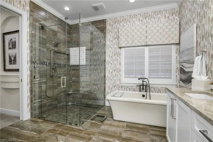 Walk in shower, soaking tub, flooring is tile