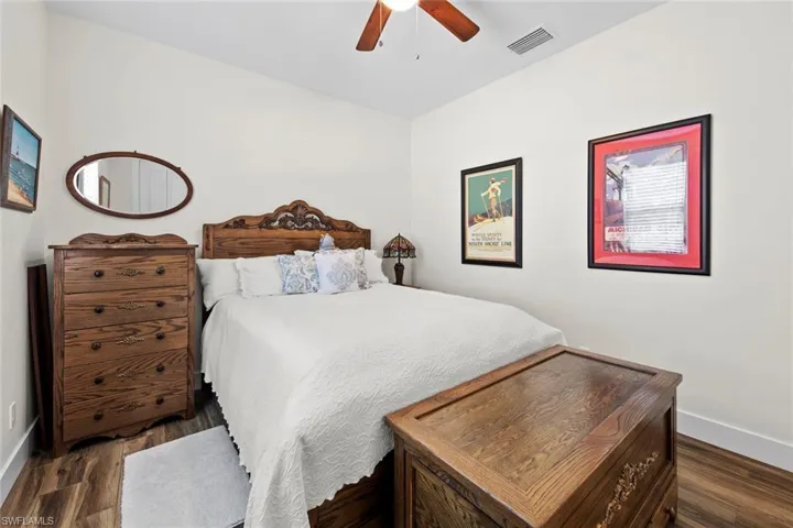 Bedroom #2 with ceiling fan and dark wood-type flooring