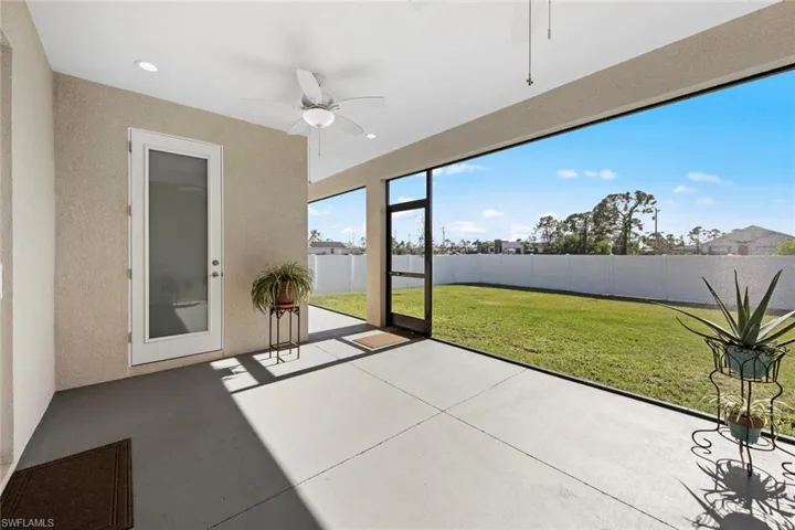 Screened Lanai featuring ceiling fan and pool bath