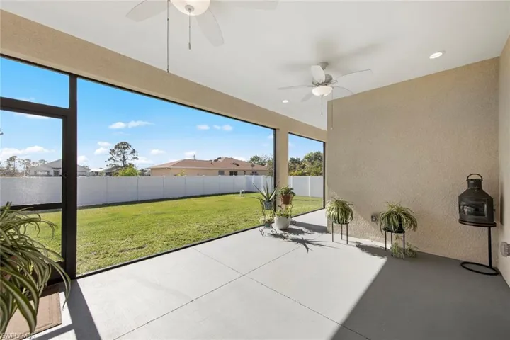 Screened Lanai featuring ceiling fan