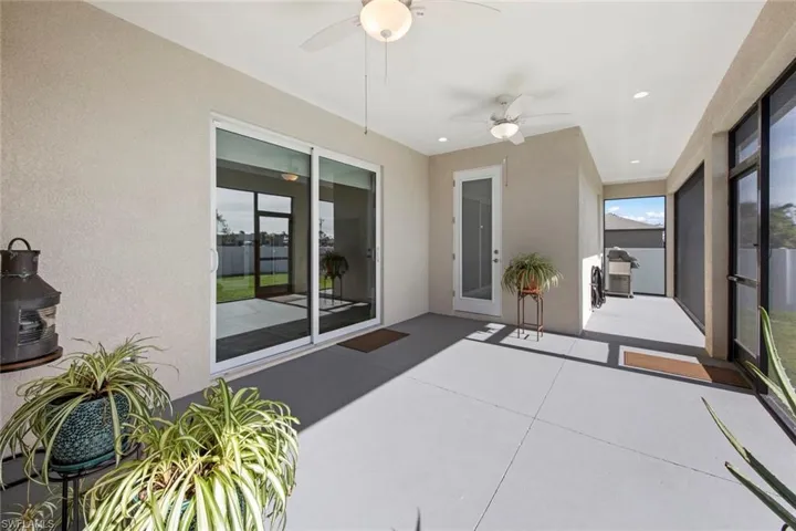 Screened Lanai featuring ceiling fan and pool bath