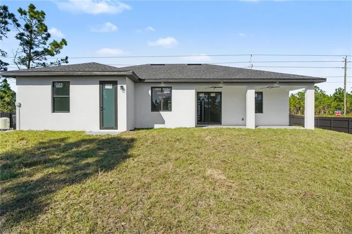 Rear exterior of home with covered patio