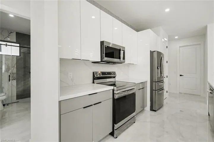 Spacious kitchen with tray ceiling and open-concept layout