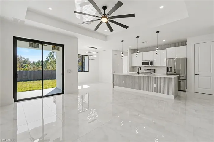 Open kitchen with modern cabinetry and stainless steel appliances