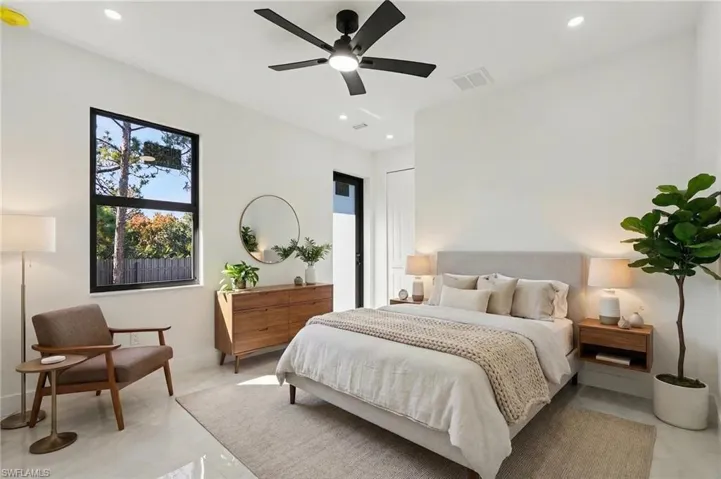 Bedroom with ceiling fan and recessed lighting