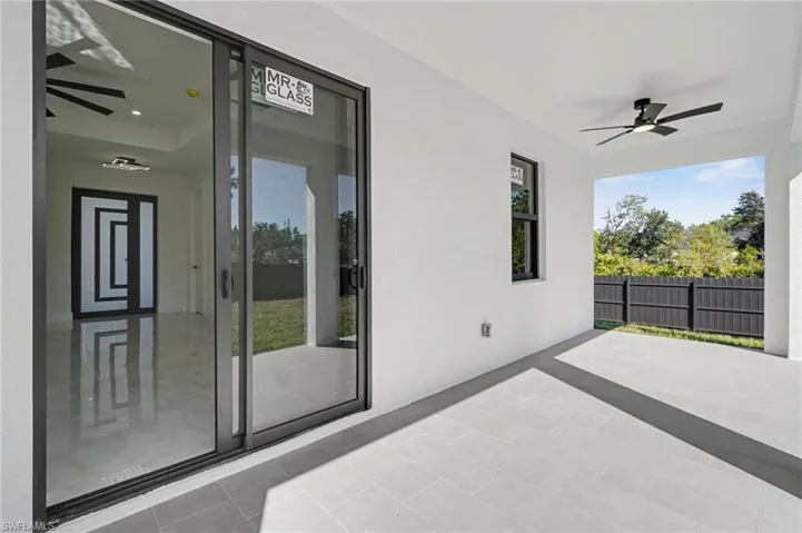 View of patio featuring a ceiling fan