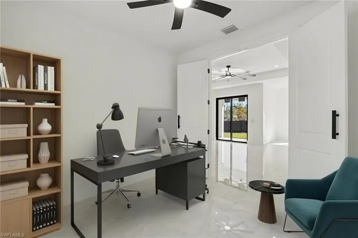 Office space with ceiling fan and recessed lighting