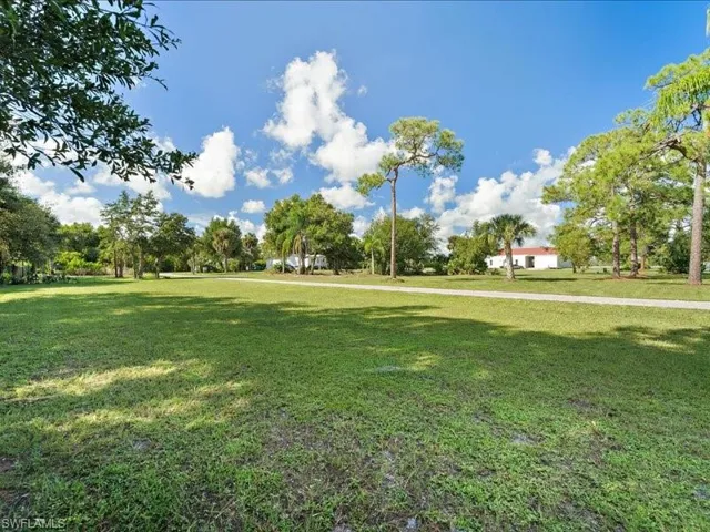 Surrounding community featuring a lawn