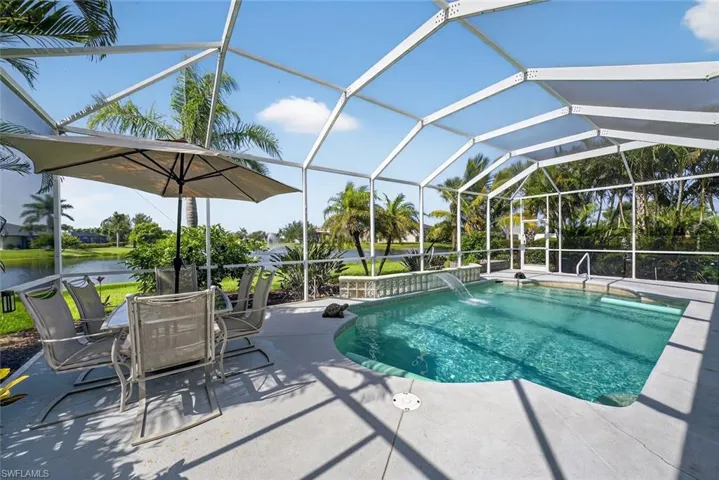 Swimming pool with a patio area in the screened lanai