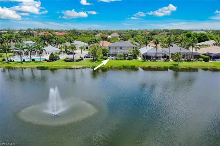 Aerial view of the back of structure and the lake