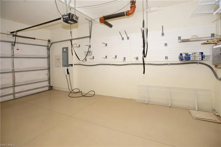 Garage with a garage door opener and Tesla Charging station