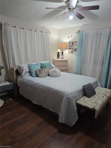 Bedroom featuring ceiling fan and wood finished floors