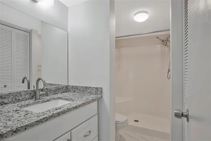 PRIMARY BATH WITH STEP IN SHOWER AND STORAGE CLOSET