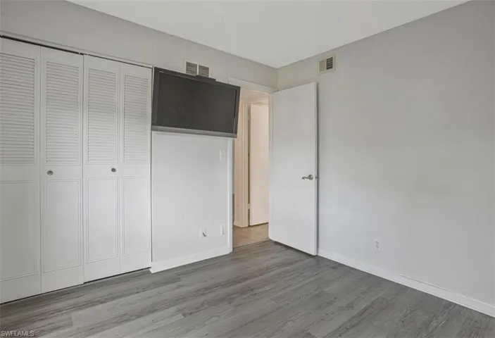 GUEST ROOM WITH WALL CLOSET AND ADJACENT BATHROOM