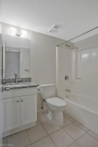 GUEST BATH WITH TUB AND SHOWER NEWER VANITY AND TILE FLOORS