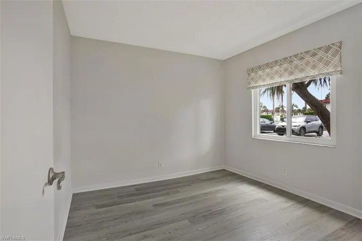 GUEST BEDROOM  LVF FLOORING AND IMPACT RESISTANT WINDOWS