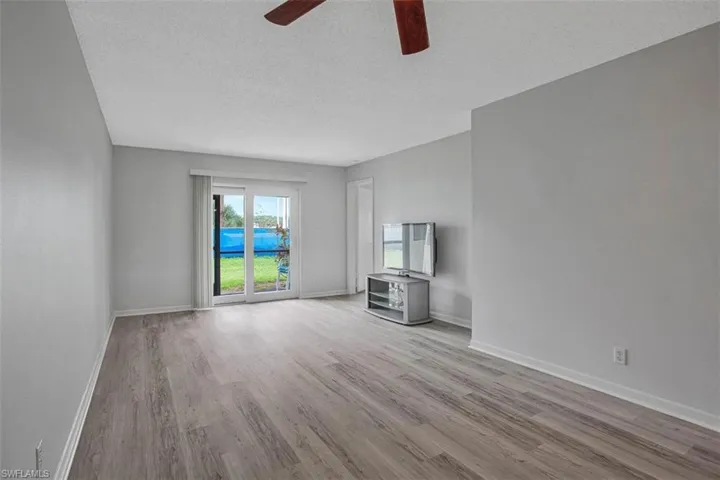 SLIDING GLASS IMPACT RESISTANT DOORS TO LANAI