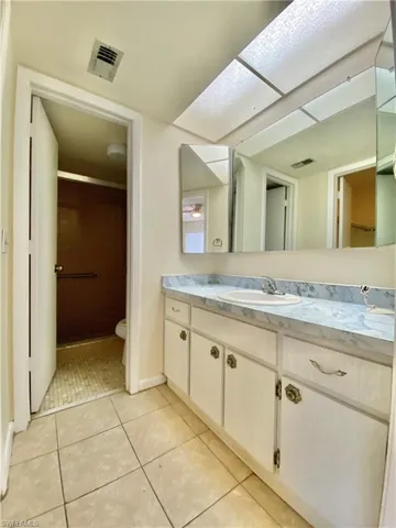 Bathroom with vanity and tile patterned flooring