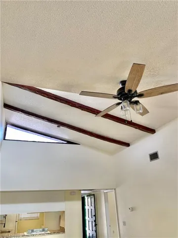 Detailed view of a textured ceiling and ceiling fan