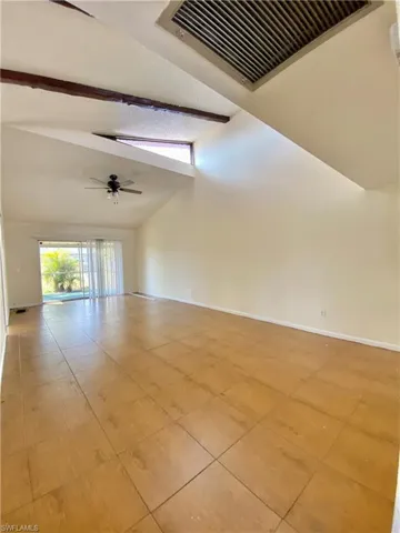 Spare room featuring light tile patterned flooring and a ceiling fan