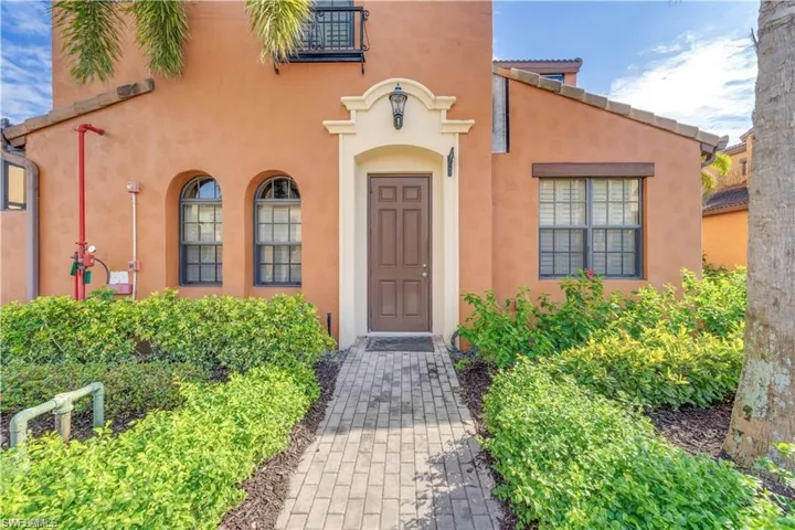 Property entrance featuring stucco siding