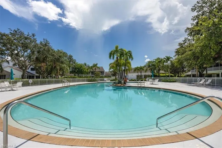 Community pool featuring a patio area