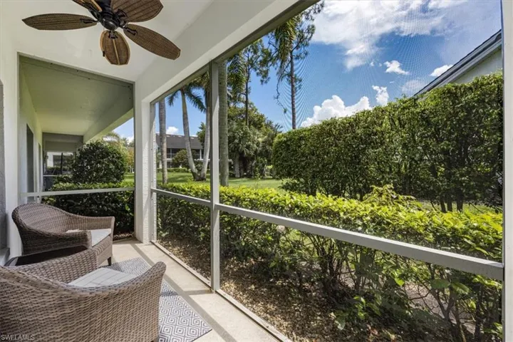 Sunroom with a ceiling fan