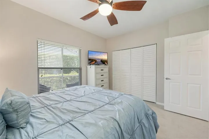 Bedroom with a closet and a ceiling fan